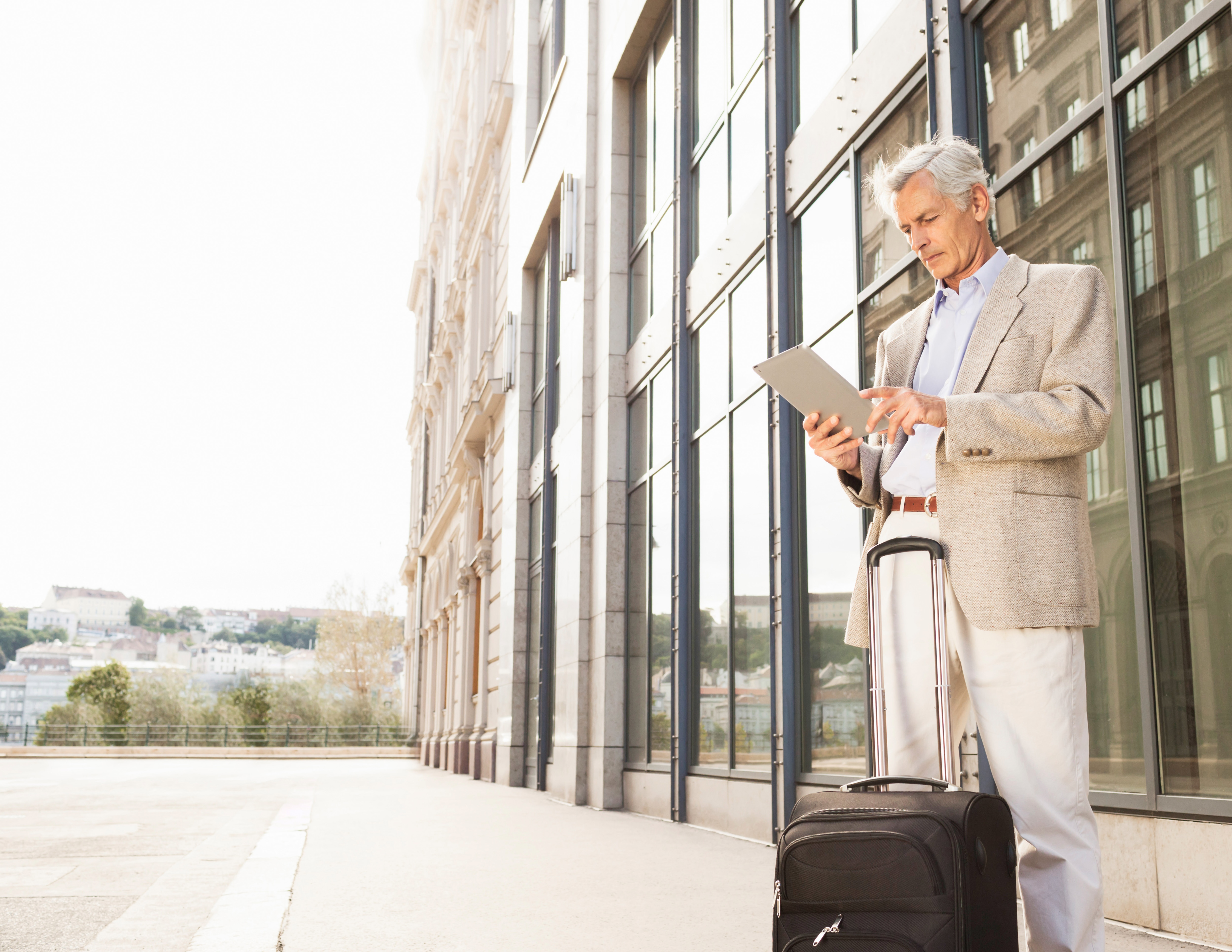 Man waiting with suitcase