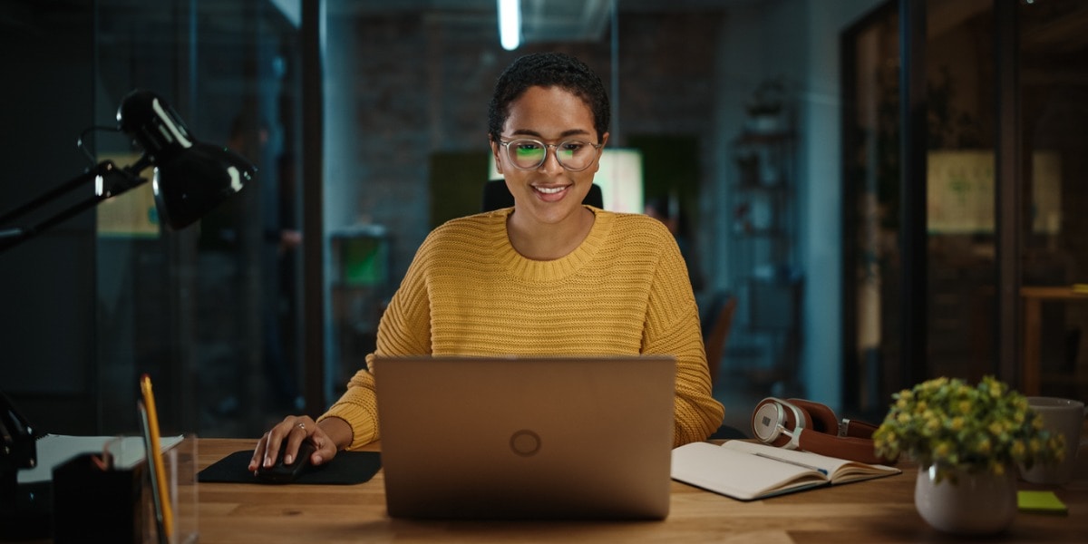 Woman sitting in front of laptop