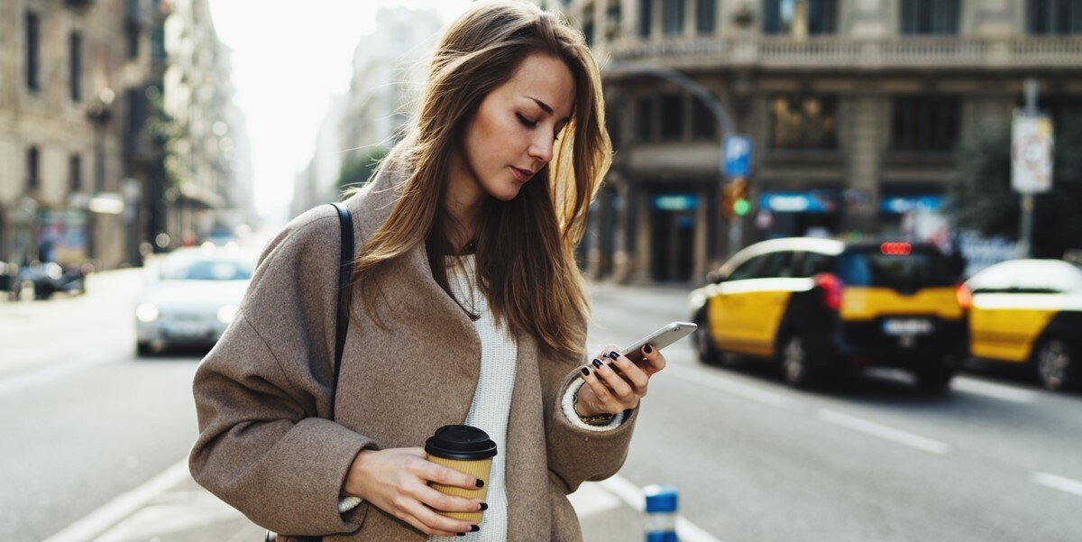 woman in city looking at phone
