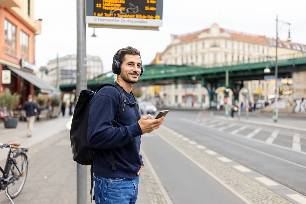 Man standing at bus stop