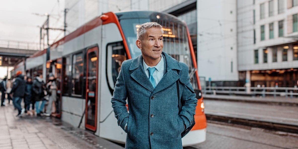 traveler standing in front of train