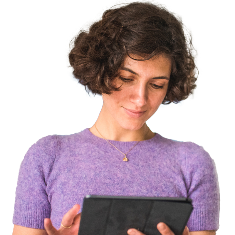 woman looking at tablet
