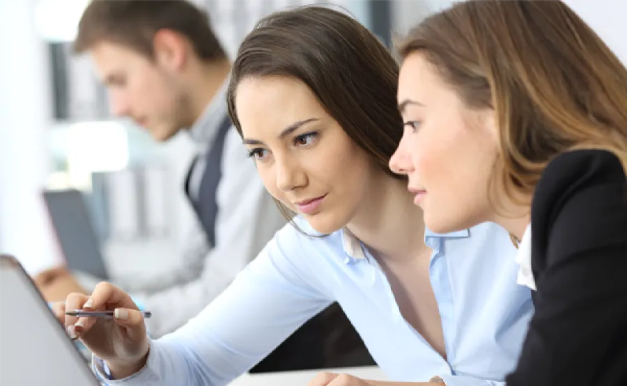 Woman pointing something out to a teammate