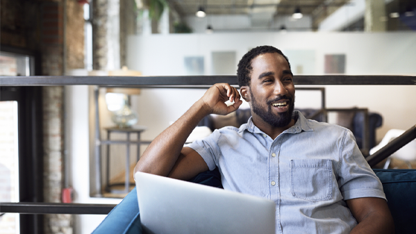 happy worker at laptop
